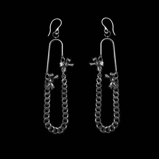Pair of silver chain earrings on a black background