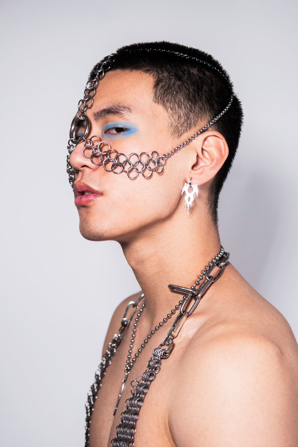  Stainless steel LANGUAGE EARRINGS 2.0 by New York Based designer SKNDLSS . TRIBAL Y2K