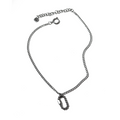 A silver-colored stainless steel necklace with a pearly carabiner clip, curb chain, and a signature fae engraved tag.