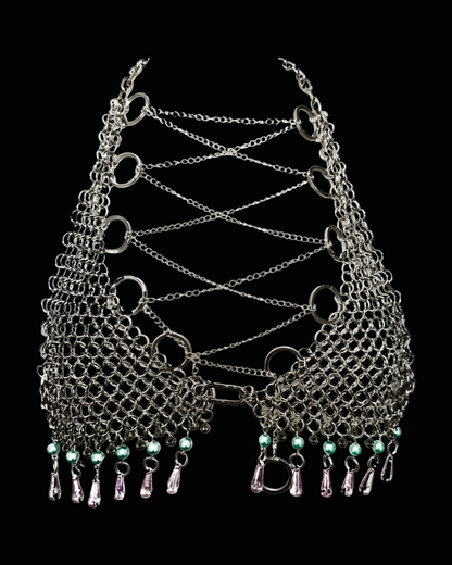 Metallic chainmaille bra with green beads on a black background SKNDLSS