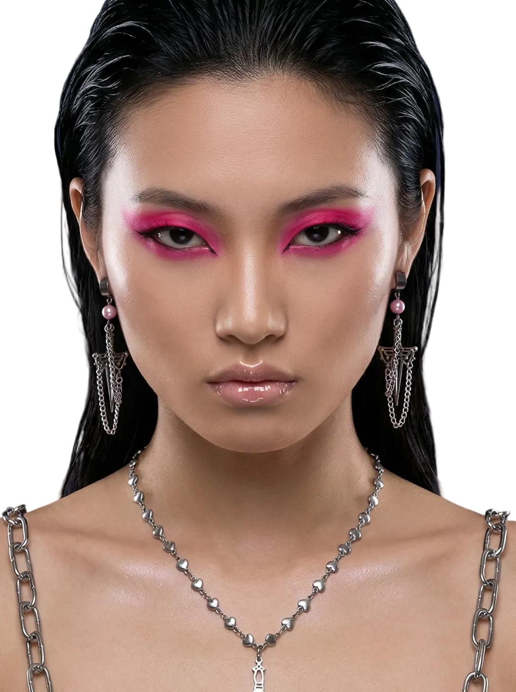 Woman with pink eye makeup and chain accessories against a dark background SKNDLSS designer 

